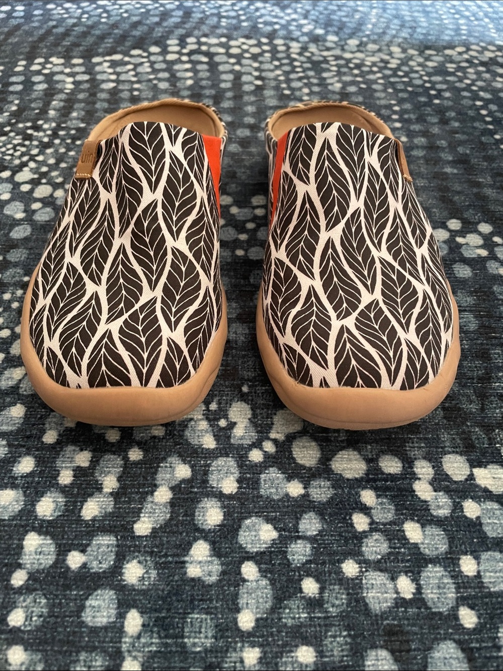 UIN mules black and white leaf pattern with orange accent
